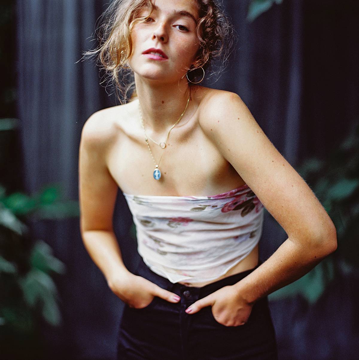 fashion portrait on kodak portra 800 film with hasselblad 202fa of girl in bandana top and black jeans